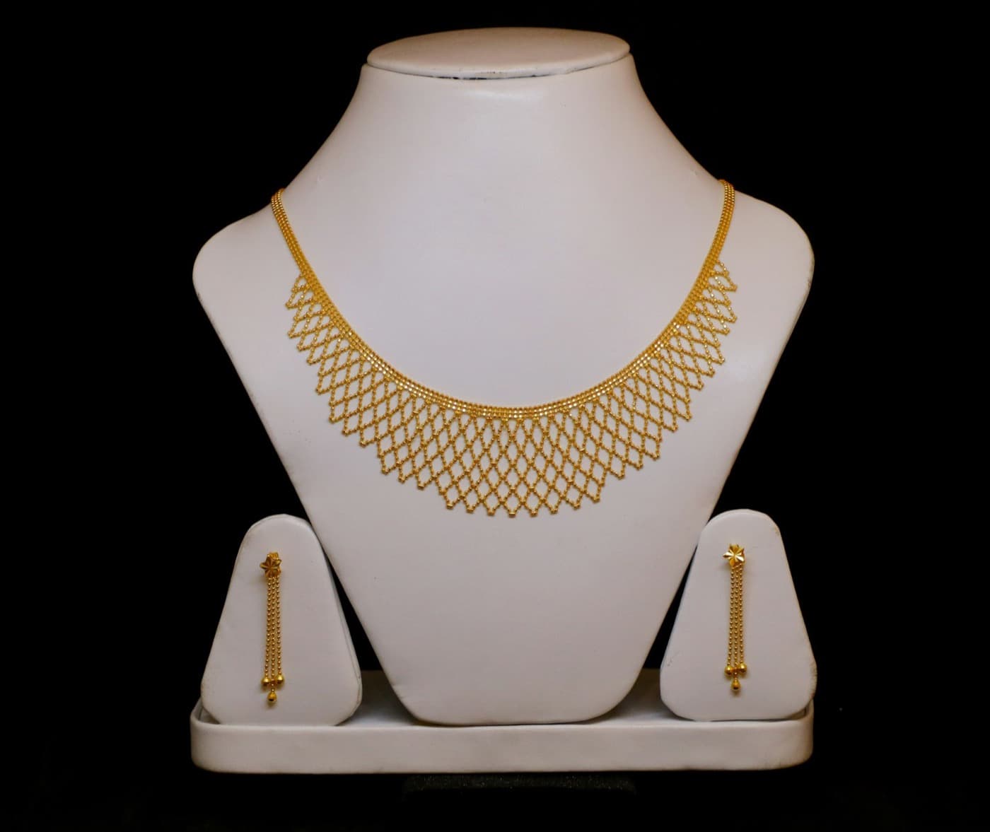 Gold necklace and earring set